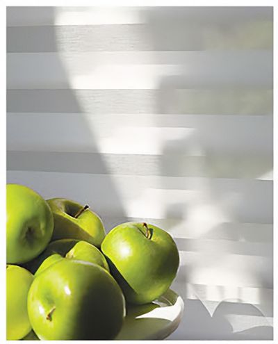 Love is Blinds MO: A bowl of green apples is sitting on a table, and white honeycomb shades.