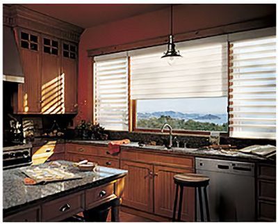 Love is Blinds MO: A kitchen with wooden cabinets, granite counter tops,  and a window with blinds.