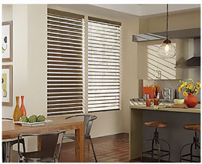 Love is Blinds St. Louis: A kitchen with a table and chairs and blinds on the windows.