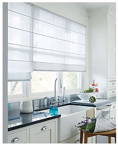 Love is Blinds St. Louis: A kitchen with a sink and a window with roman shades.
