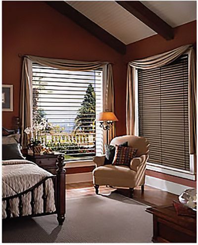 Love is Blinds St. Louis: A bedroom with a bed a chair and a window with blinds