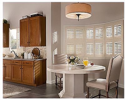 Love is Blinds St. Louis: A kitchen with a table and chairs and window shutters. 