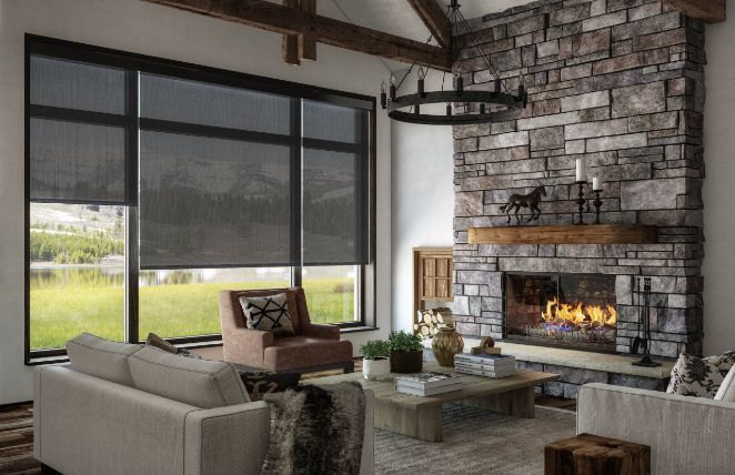 Love is Blinds MO: A living room with a fireplace, a couch, and black roller shades on windows.