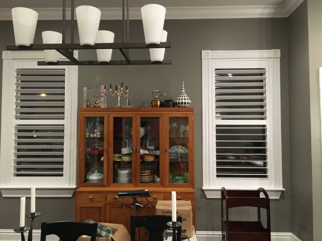 Love is Blinds, MO: Plantation shutters are on the windows of a dining room. 