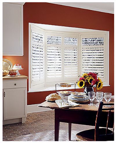 Love is Blinds St. Louis: A kitchen with a table and chairs and a window with shutters