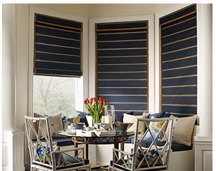 Love is Blinds St. Louis: A table and chairs in the corner of the room with woven wood blinds on the windows. 