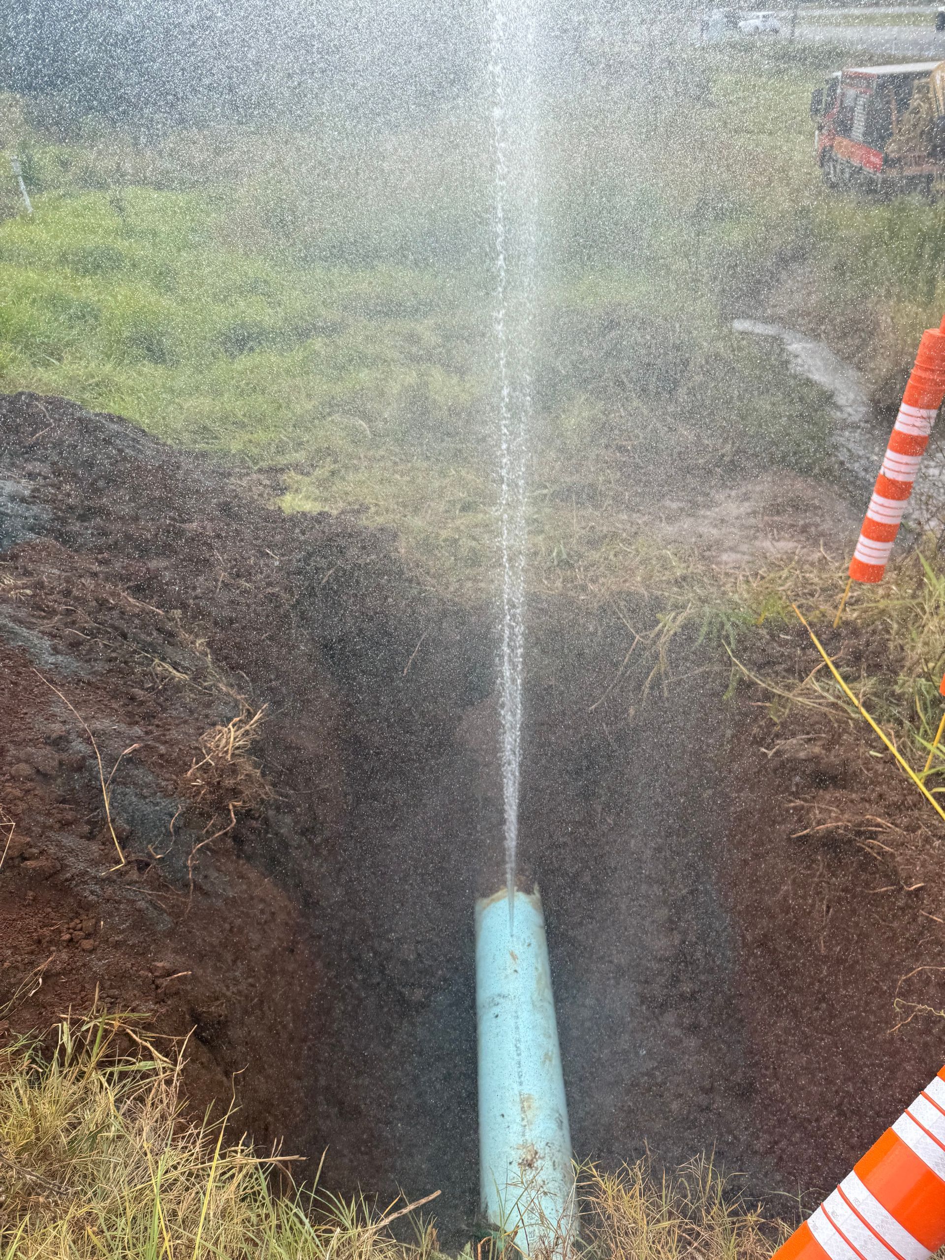 Water Spurting High From a Broken Blue Pipe — Commercial Leak Detection in Mudgeeraba, QLD