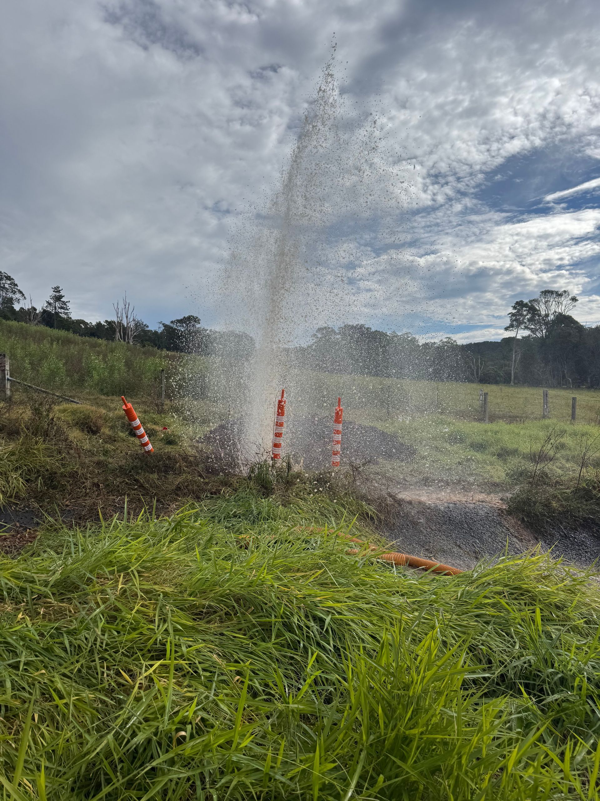 Water Erupts From a Hole in a Grassy Field — Commercial Leak Detection in South Brisbane, QLD