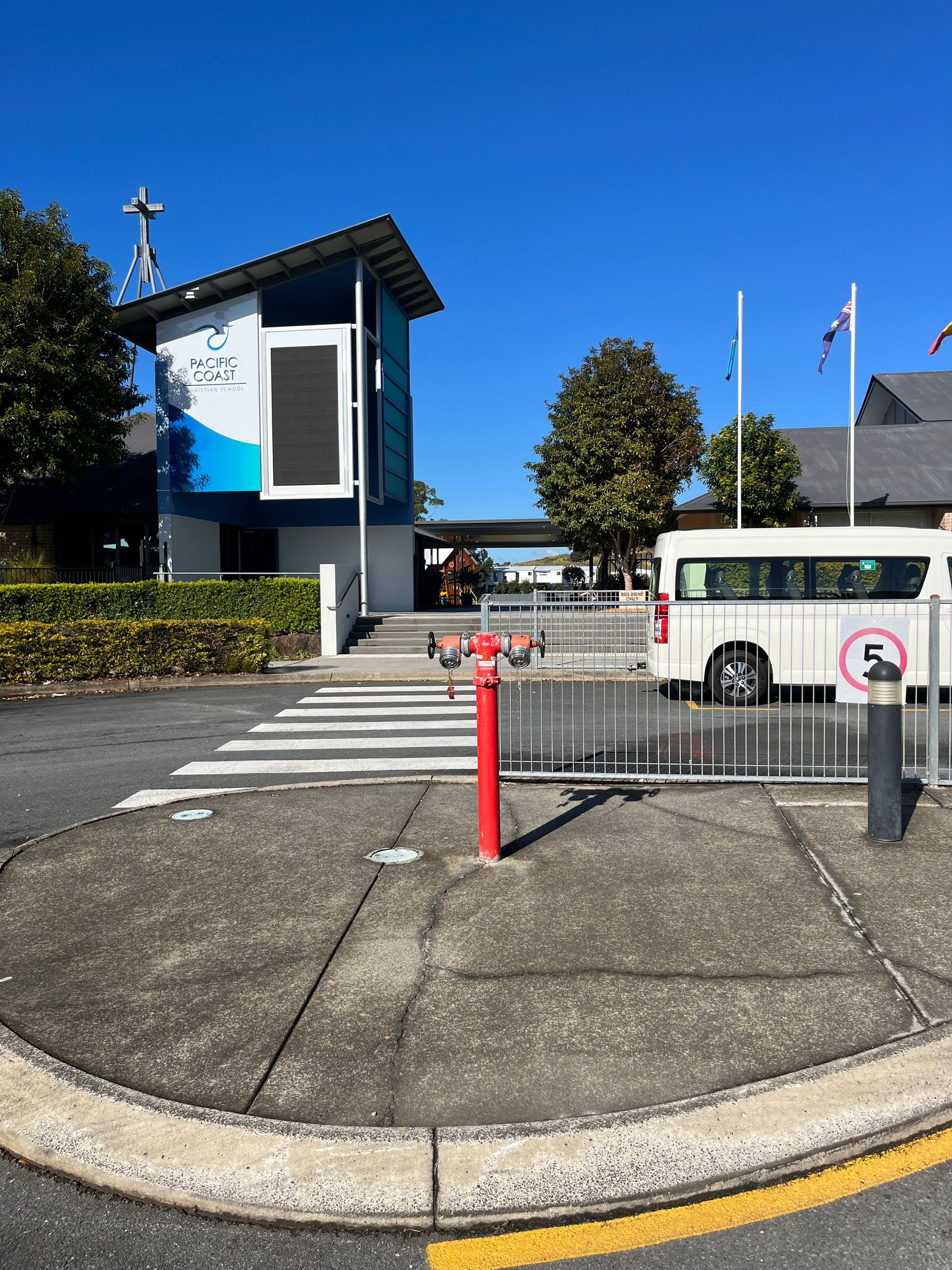 Building Entrance With Crosswalk, Red Fire Hydrant — Commercial Leak Detection in South Brisbane, QLD