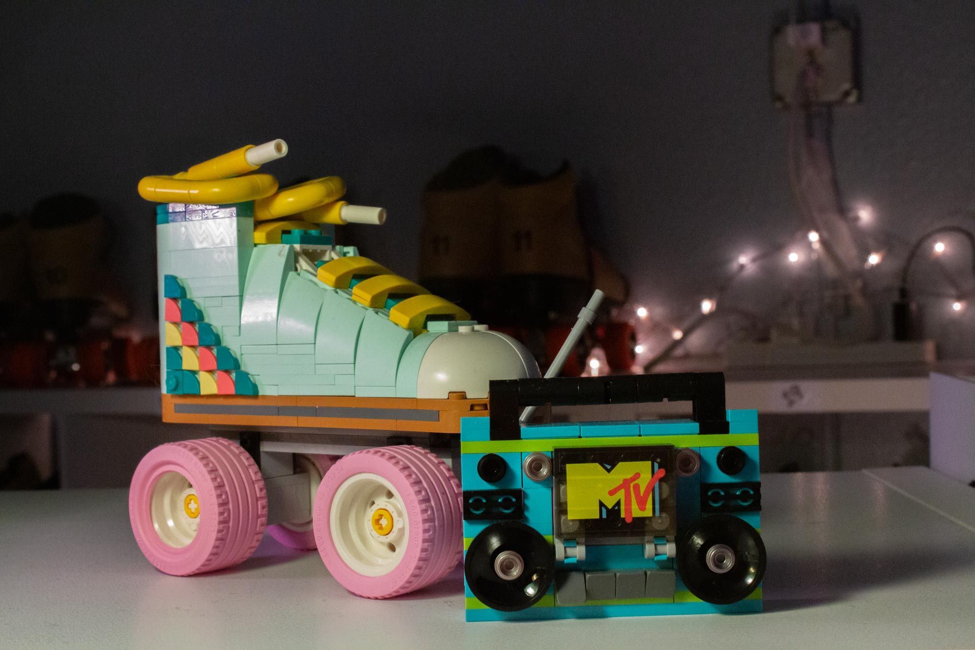 LEGO roller skate and boombox with MTV logo, pastel colors.