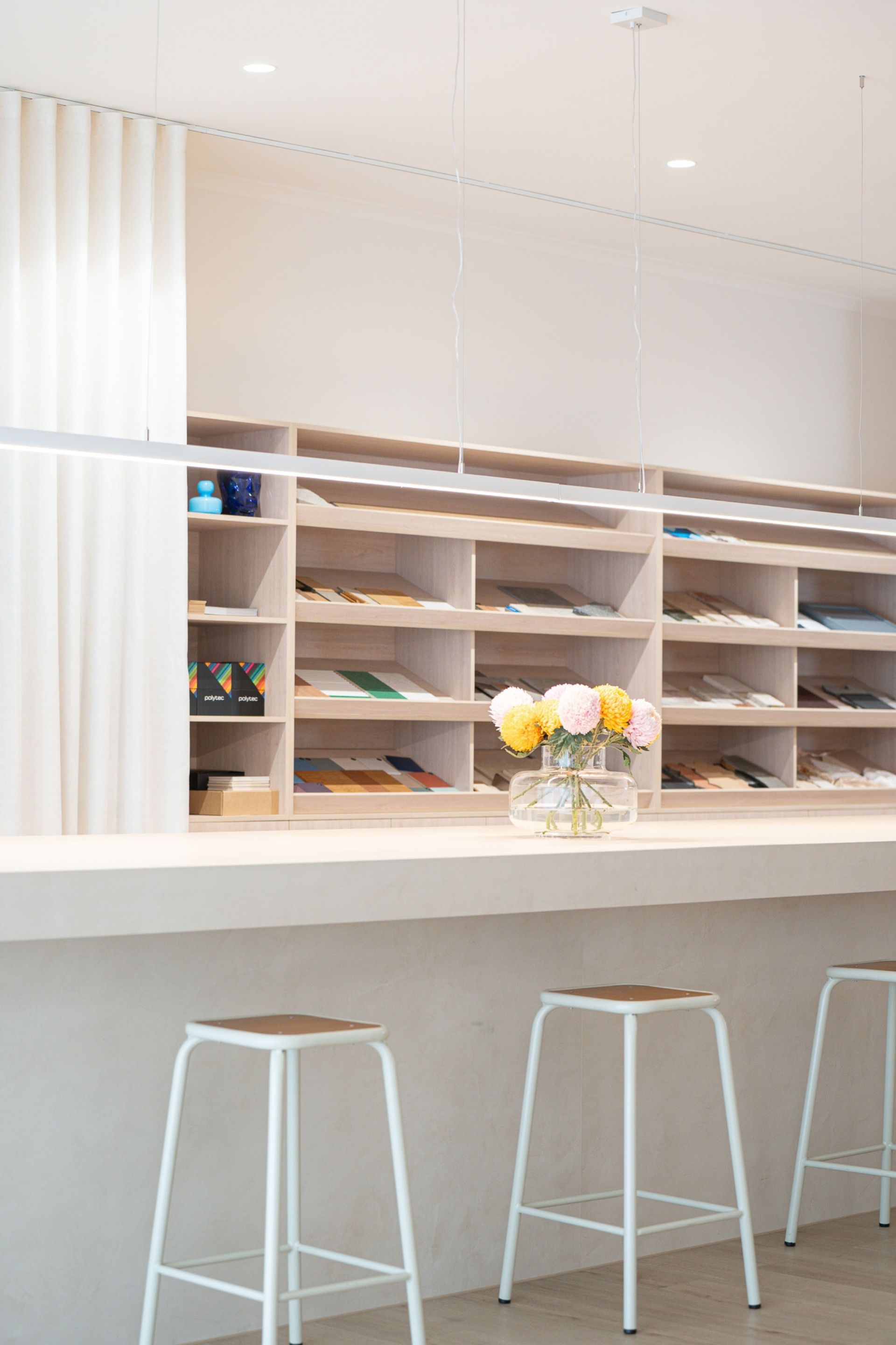 Interior of Studio 29 design studio in Cairns with material samples, shelving and workspace