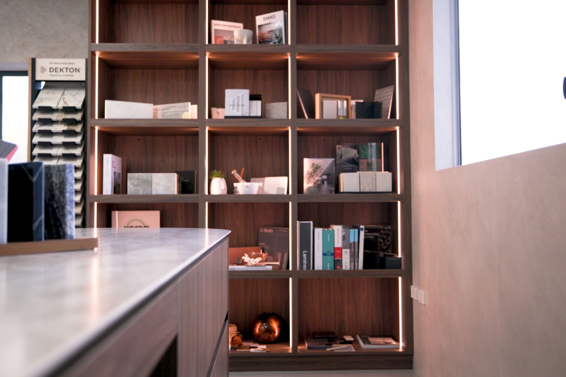 Stone surface samples and material palette arranged on timber joinery in Cosentino Cairns showroom