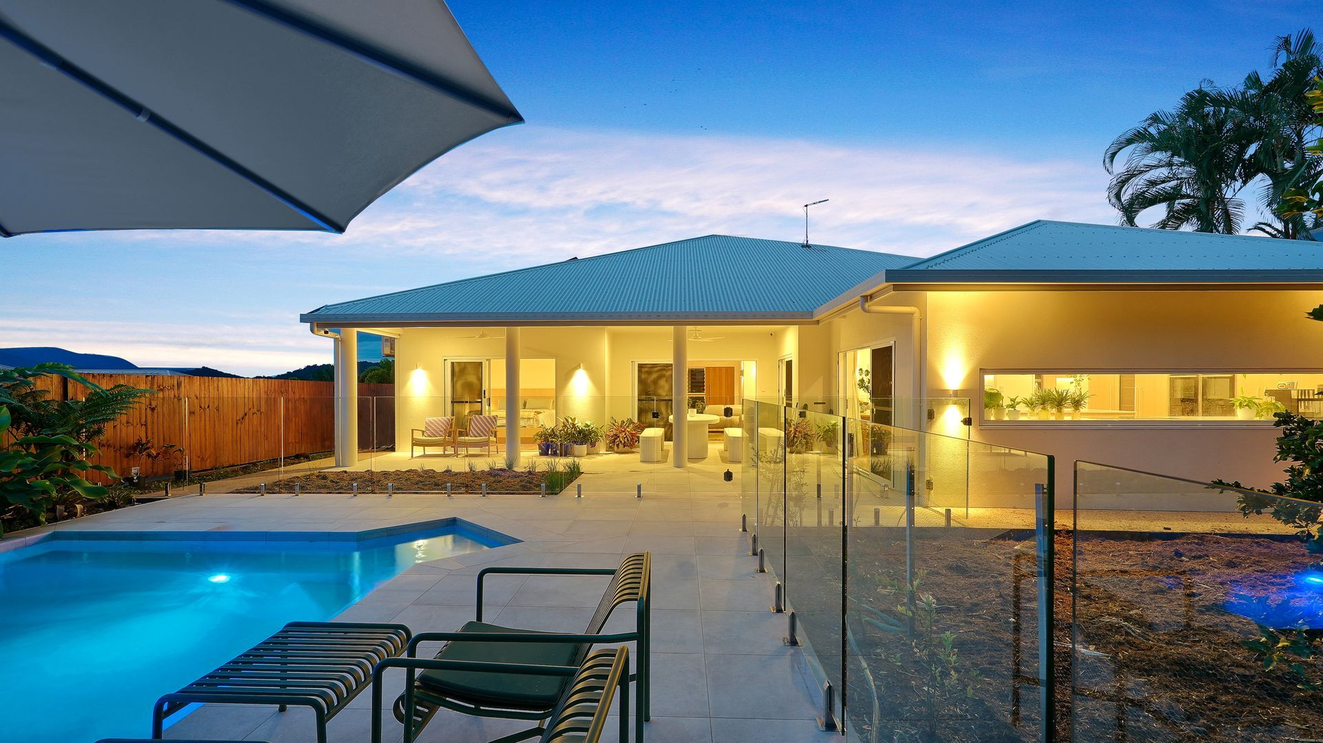 Outdoor entertaining area with pool and contemporary Cairns home design