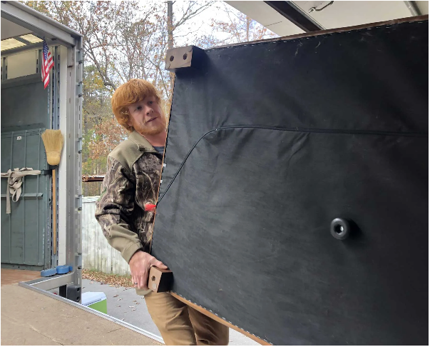 movers lifting large couch