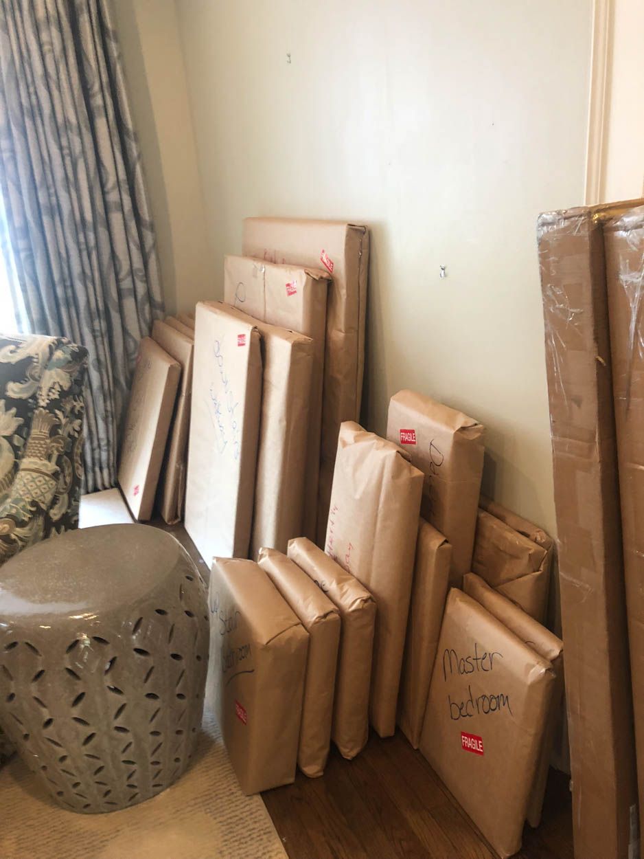 A room filled with lots of boxes wrapped in brown paper.