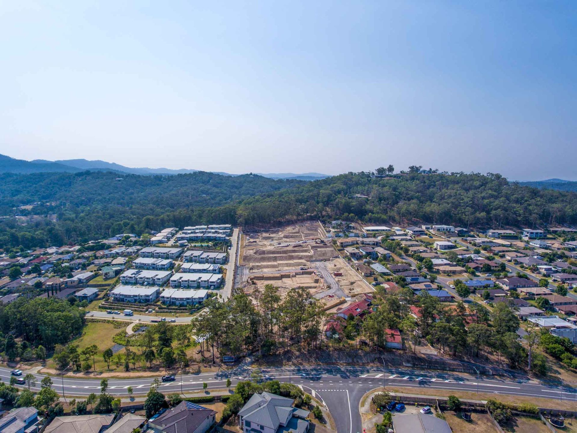 An Aerial View Of A Residential Area With A Lot Of Houses And Trees — Harrison Development Group In Surfers Paradise, QLD