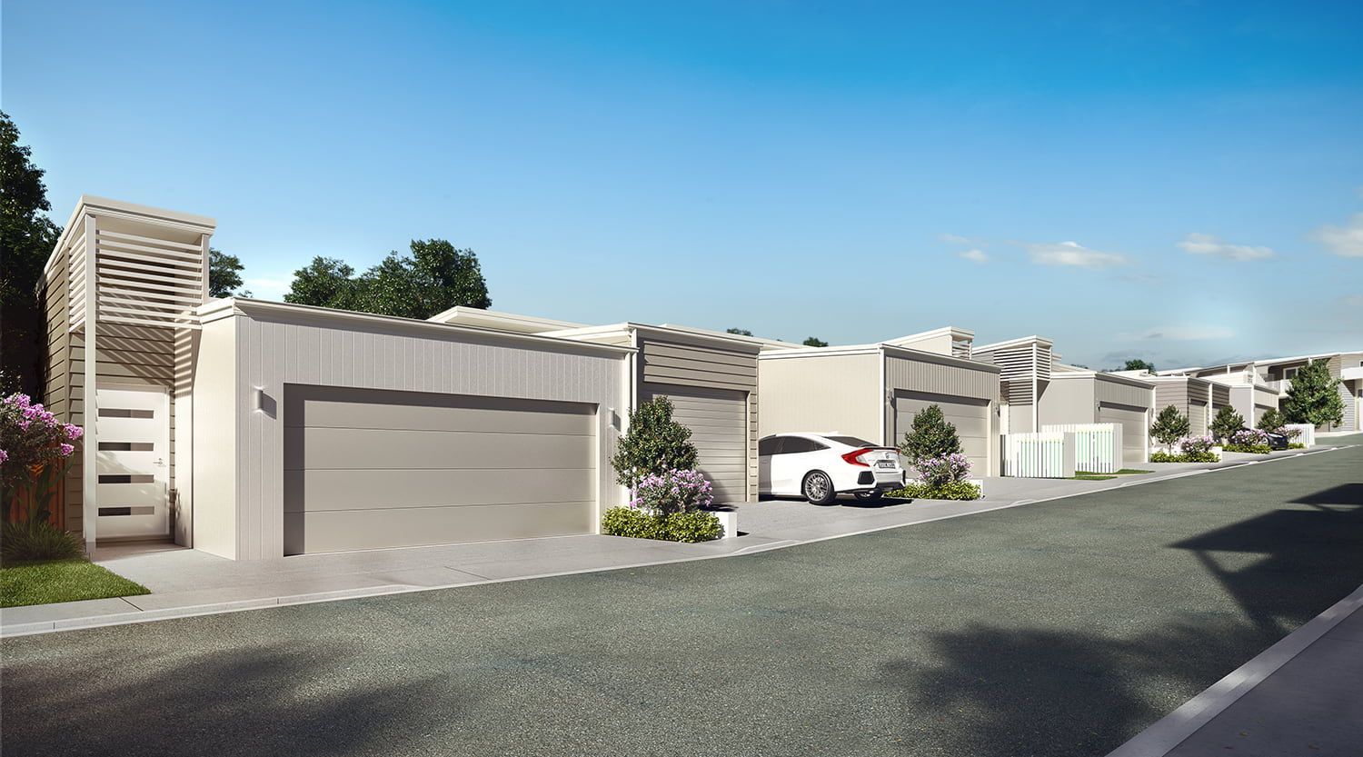 A Row Of Houses With Cars Parked In Front Of Them — Harrison Development Group In Surfers Paradise, QLD