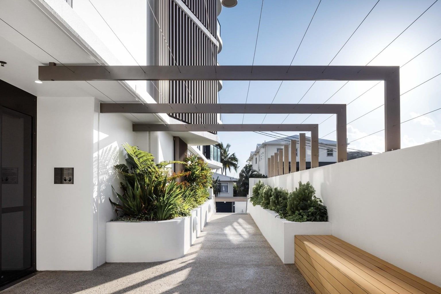A Walkway Leading To A Building — Harrison Development Group In Surfers Paradise, QLD