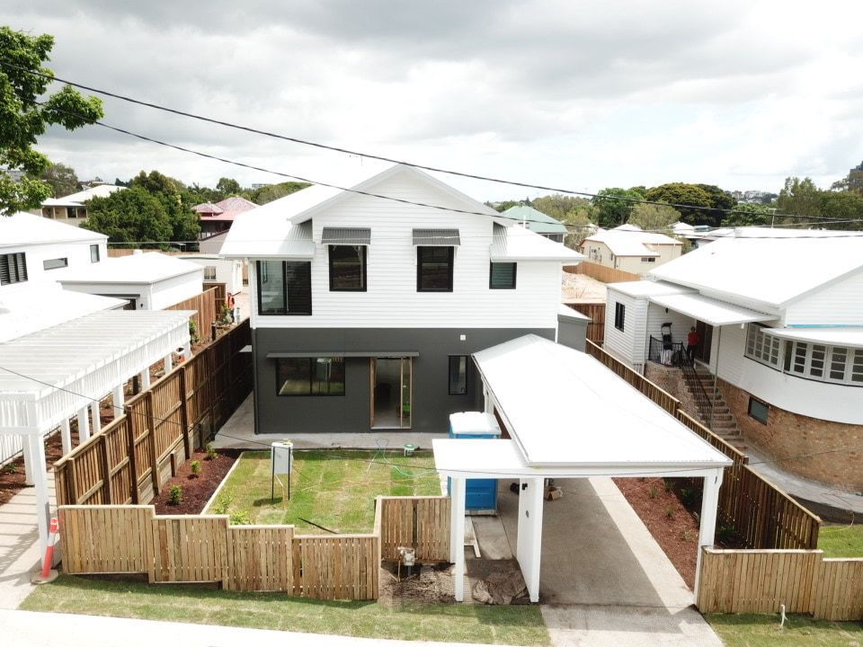 An Aerial View Of A House With A Carport In Front Of It — Harrison Development Group In Surfers Paradise, QLD