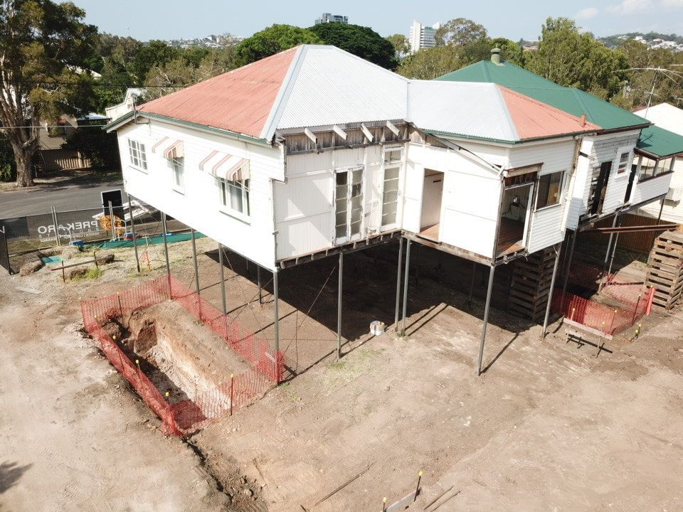 An Aerial View Of A House Being Built On Stilts — Harrison Development Group In Surfers Paradise, QLD