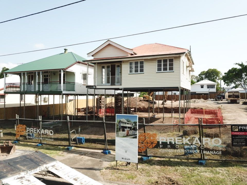 A Fenced Area With A Sign Prekaro — Harrison Development Group In Surfers Paradise, QLD