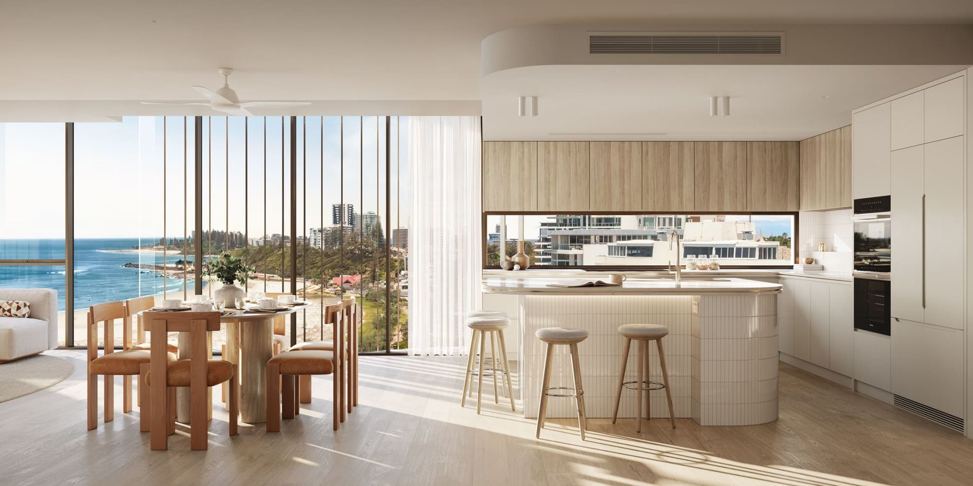 A Kitchen And Dining Room With A View Of The Ocean