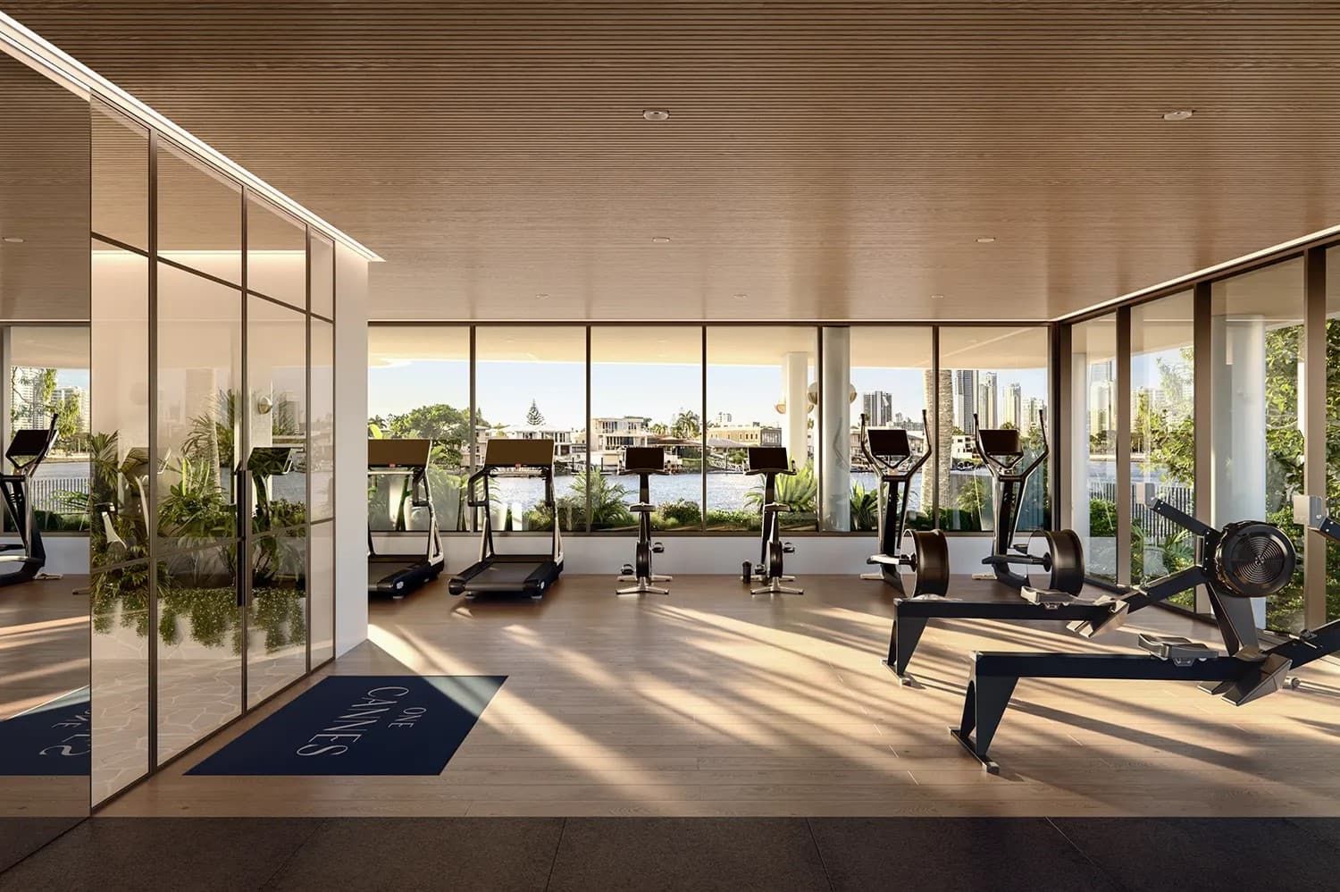 A Gym With Treadmills And Exercise Bikes — Harrison Development Group In Surfers Paradise, QLD