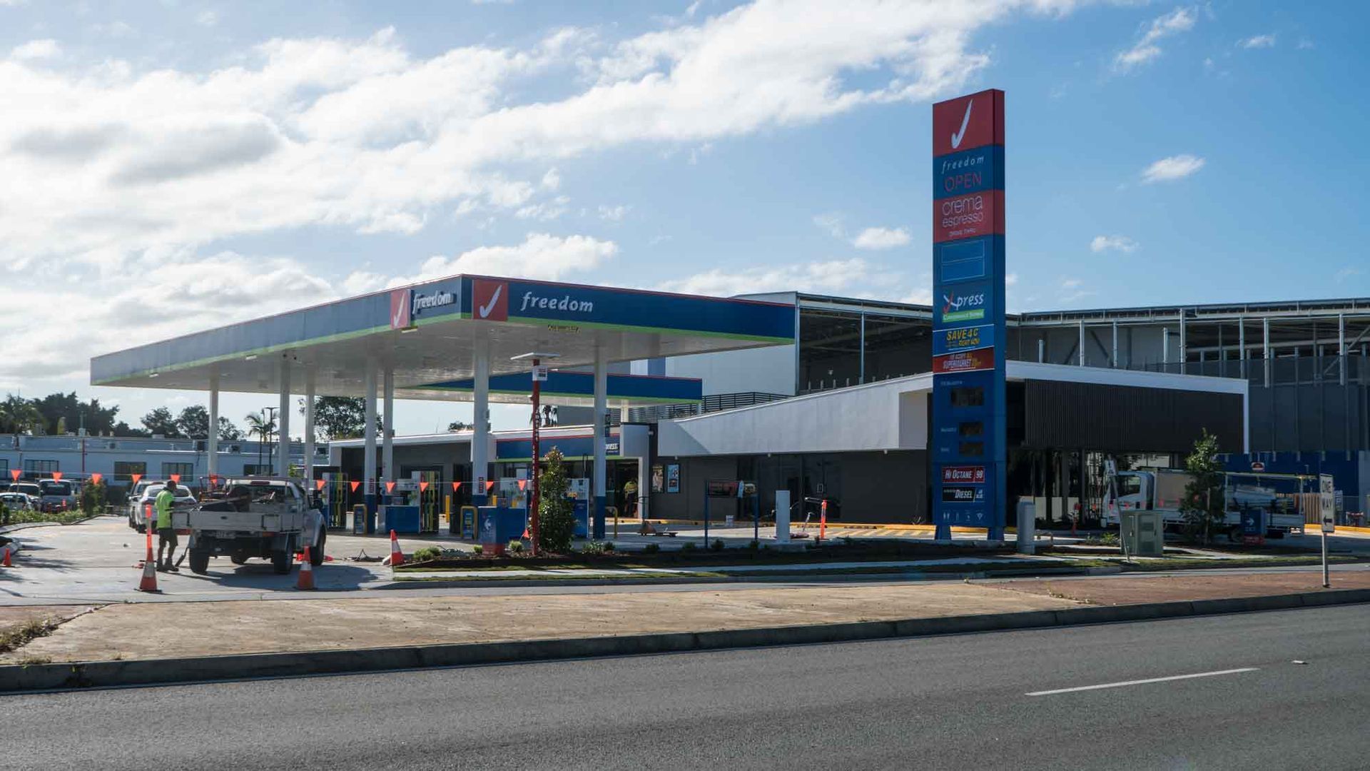 A Gas Station Is Located On The Side Of The Road — Harrison Development Group In Surfers Paradise, QLD