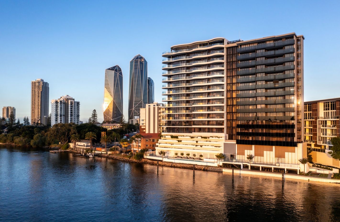 An Aerial View Of A Large Building On The Water — Harrison Development Group In Surfers Paradise, QLD