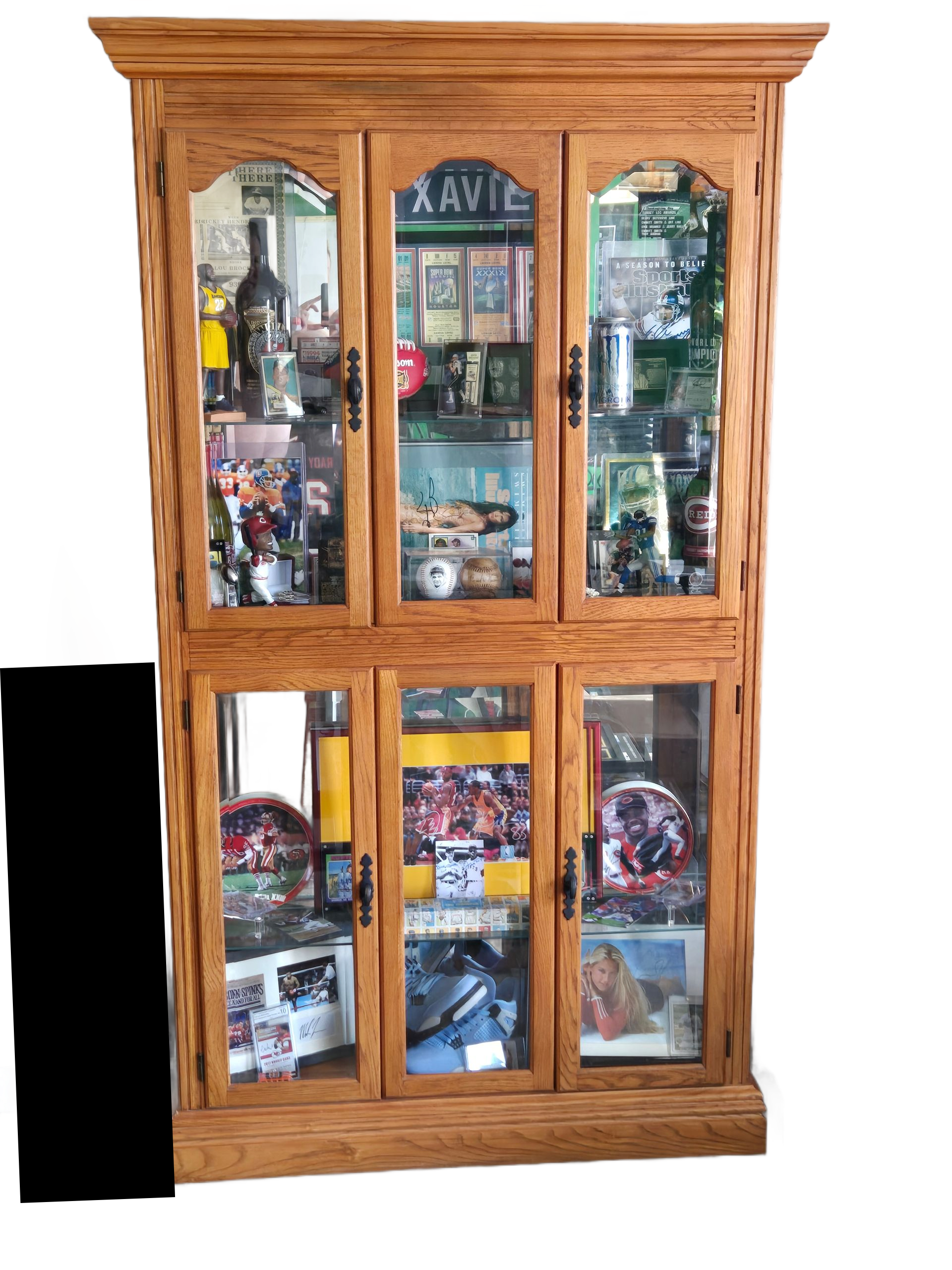 A large wooden curio cabinet filled with lots of glass doors.