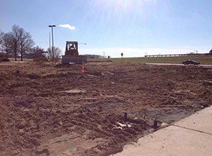 Demolition — Excavator Cleaning Construction Area in Jonesboro, AR