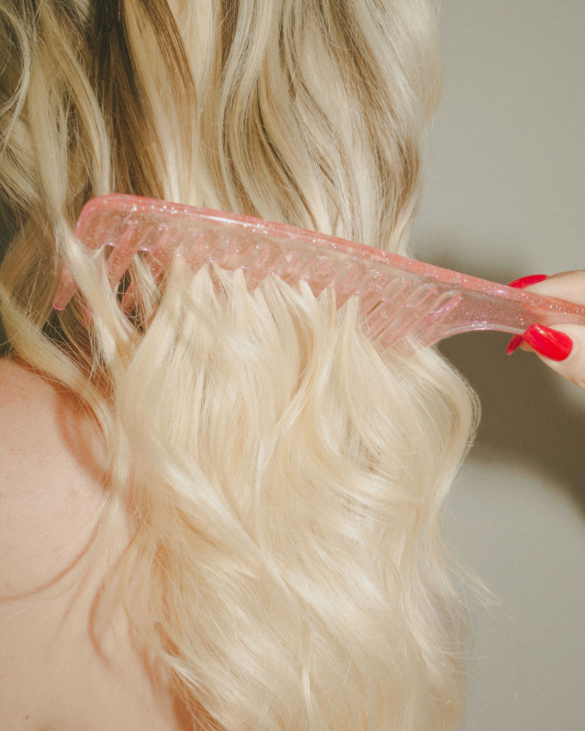 Woman combing her hair