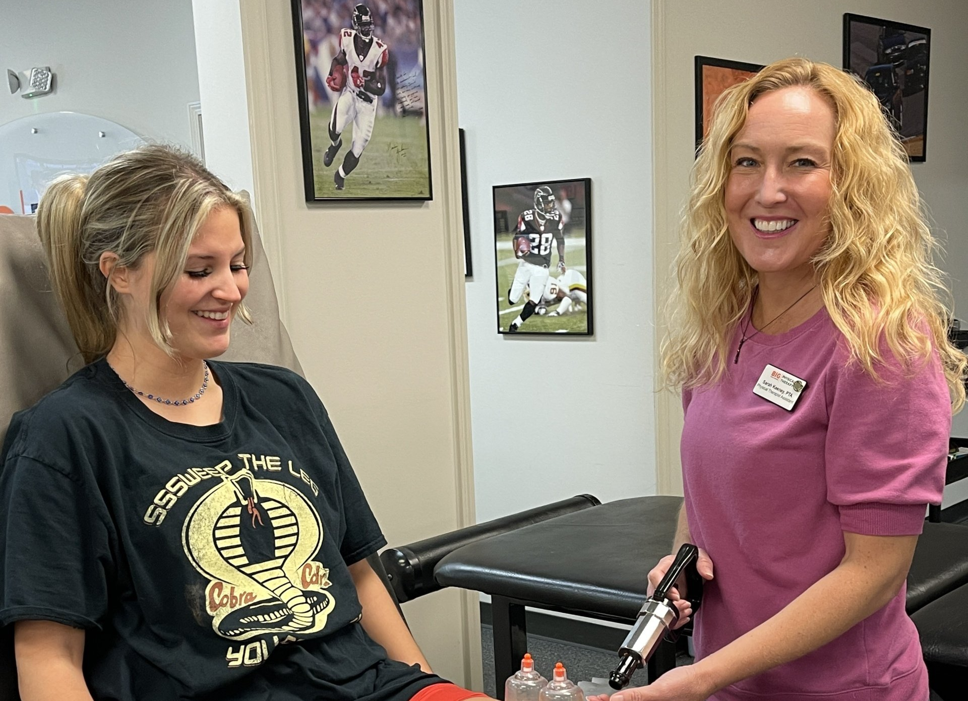 Back in the Game staff helping a patient