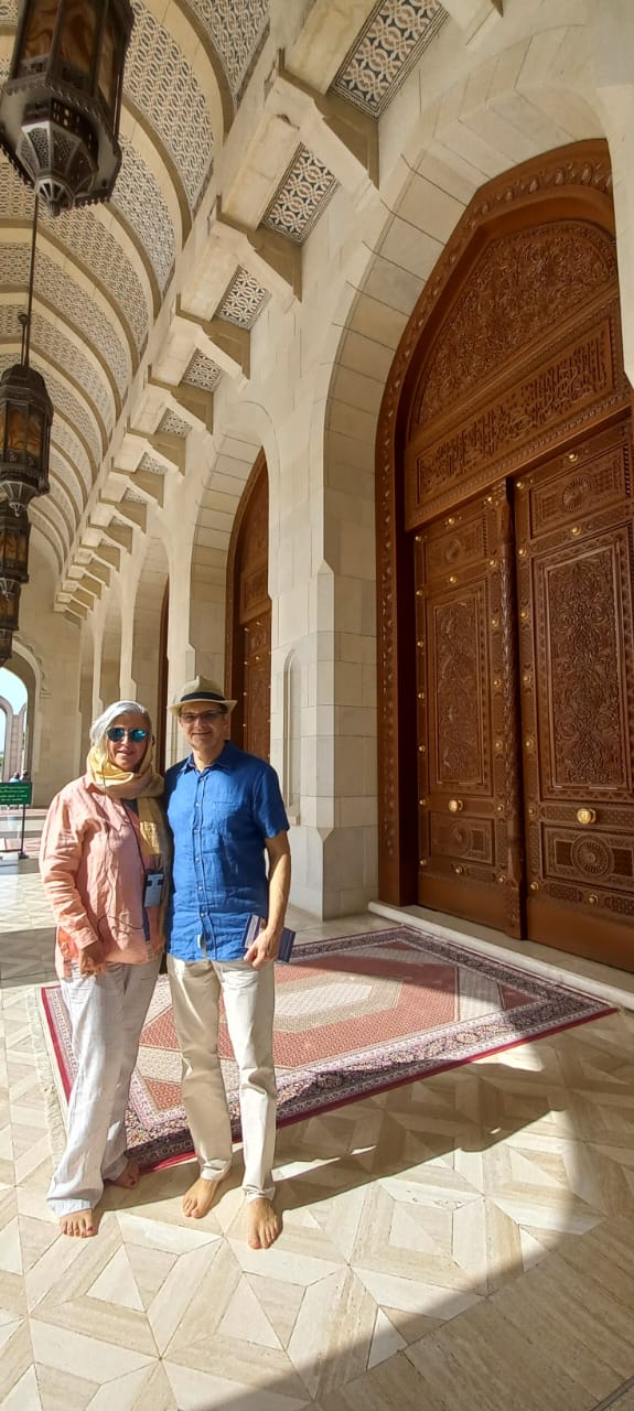 Traditional Omani coffee served in small cups with dates on the side