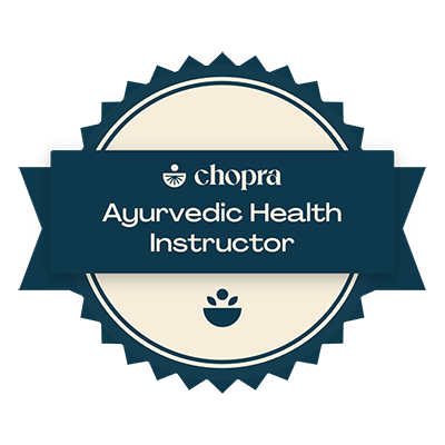 A badge that says chopra ayurvedic health instructor