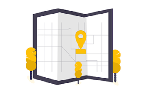 A map with a pin on it and trees in the background.