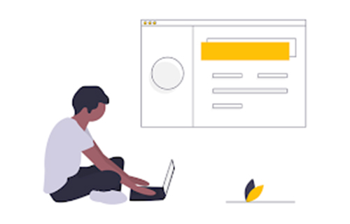 A man is sitting on the floor using a laptop computer.