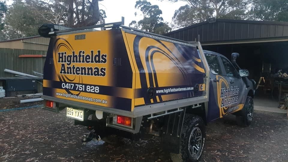 A Highfields Antennas Truck Is Parked In Front Of A Garage — Highfields Antennas In Cabarlah, QLD