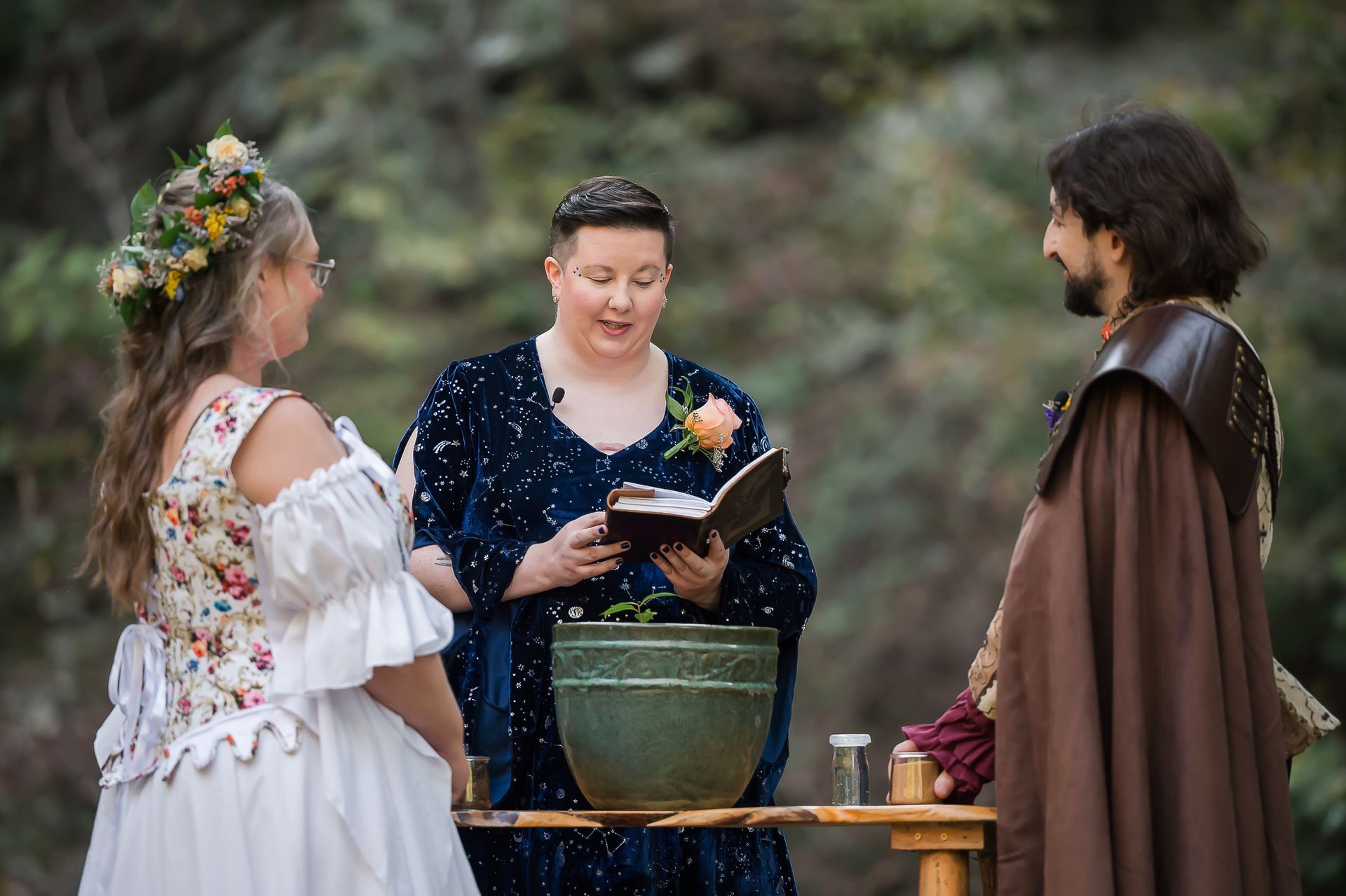 A man and a woman are standing next to each other during a wedding ceremony.