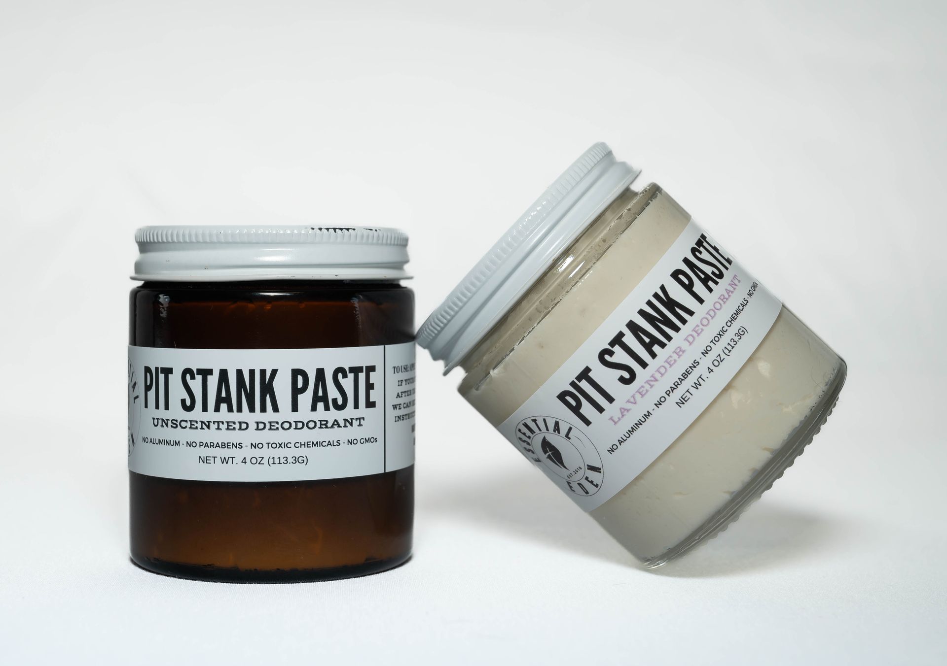 Two jars of pit stank paste are sitting next to each other