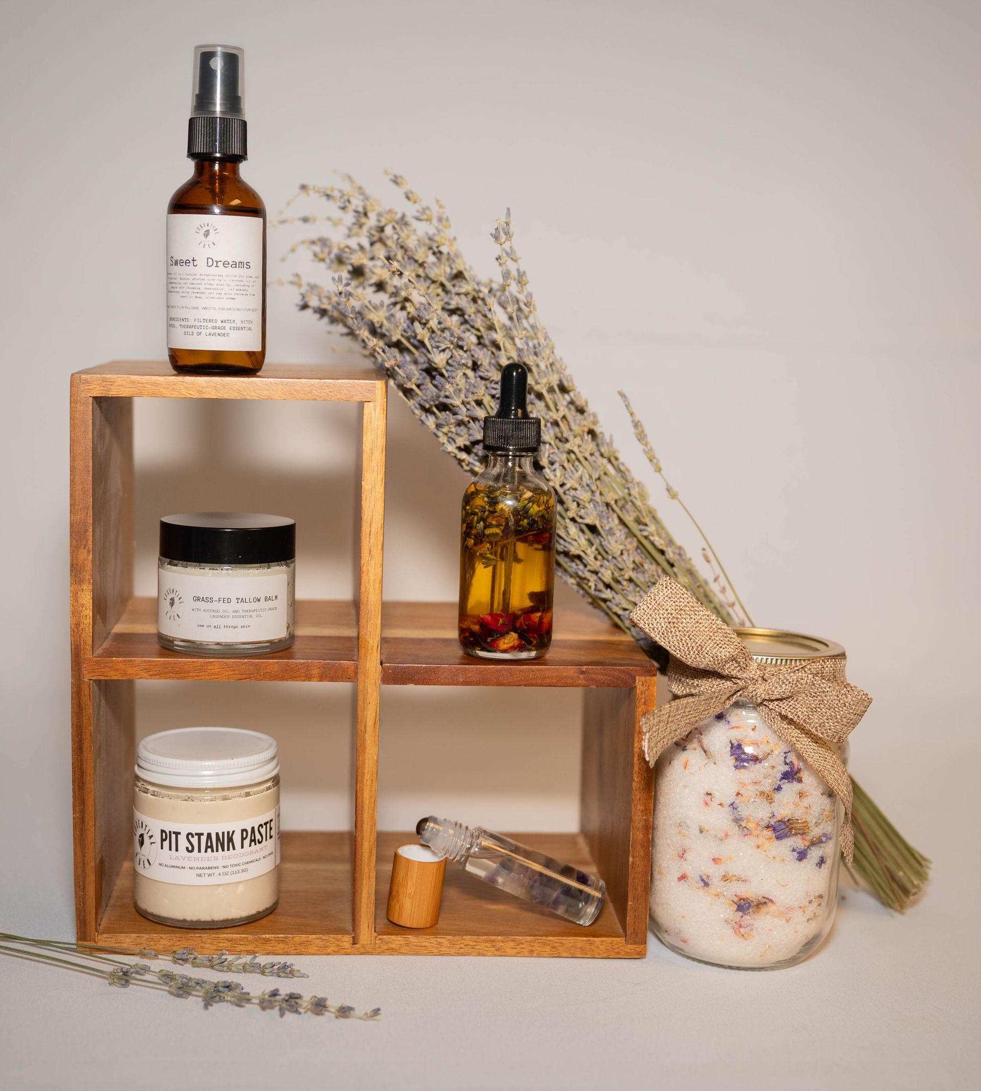 A wooden shelf with various bottles and jars on it