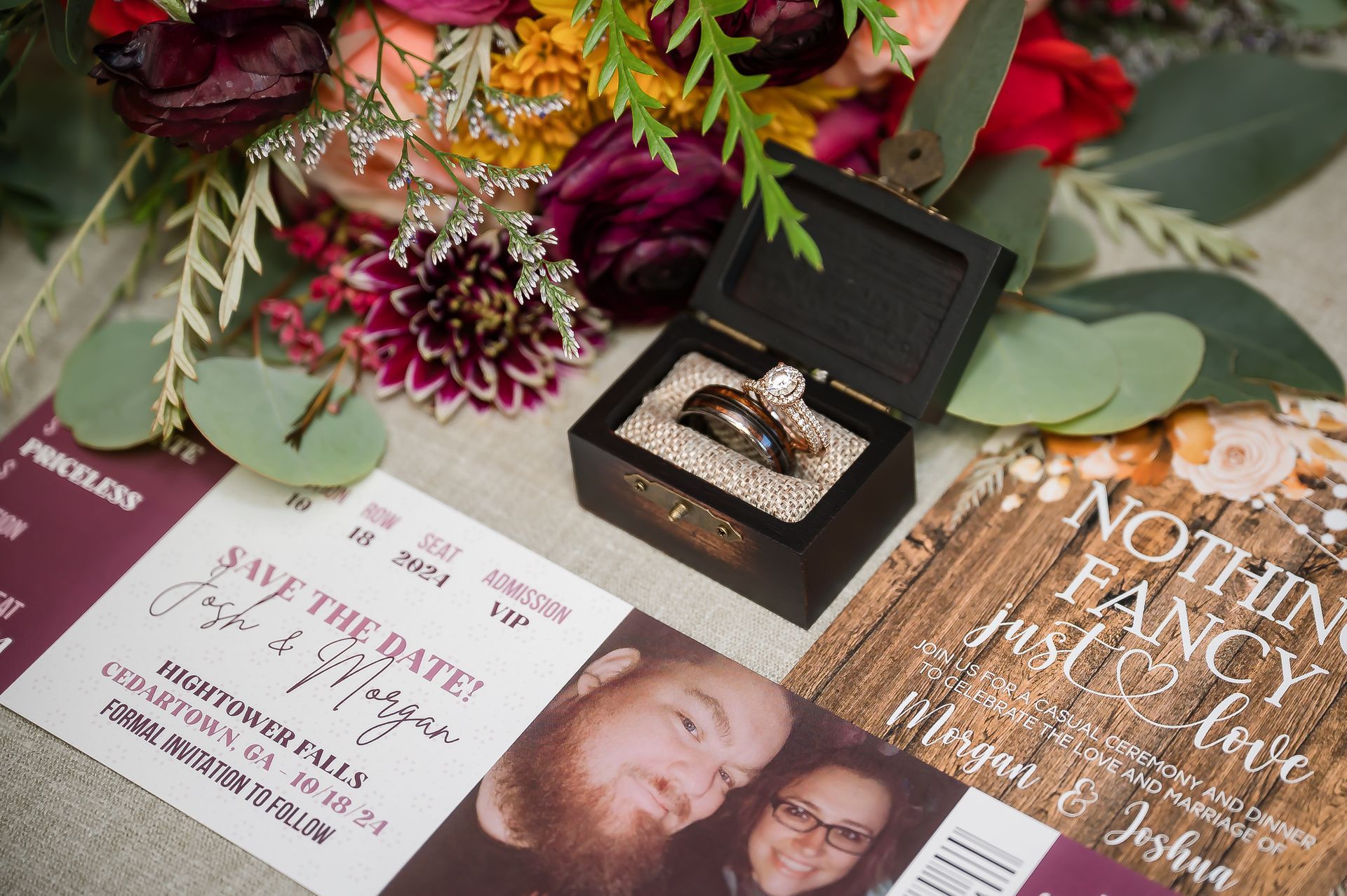 A framed picture of a man and woman kissing is sitting on a table.