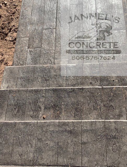 A close up of a concrete staircase with a sign on it.