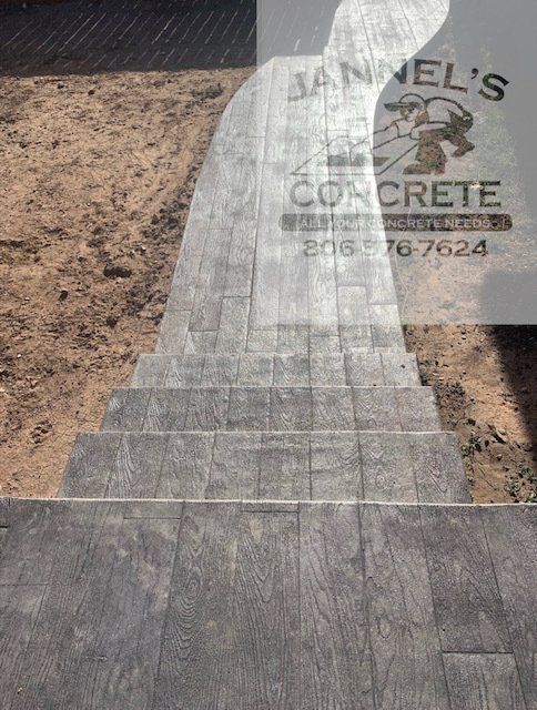 A concrete walkway with a sign that says jannel 's concrete
