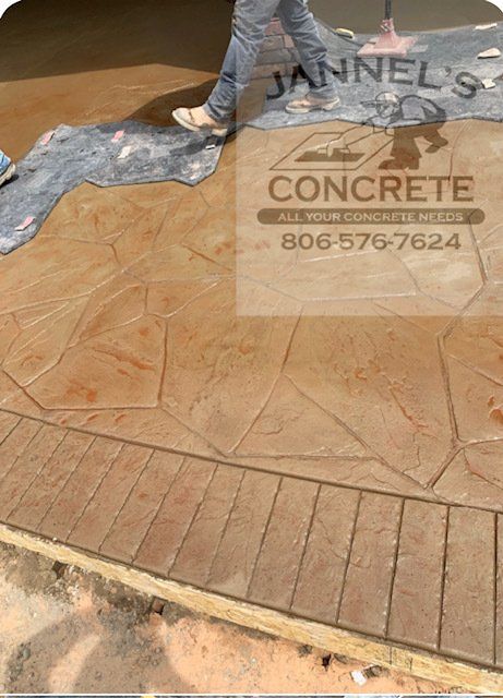 A person is walking on a concrete floor that says jannels concrete