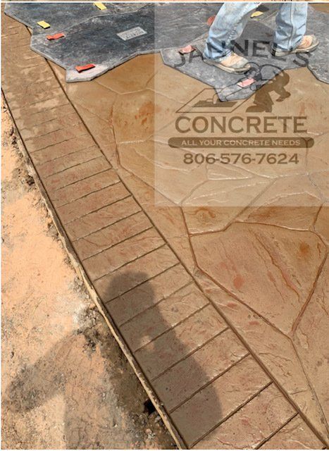 A picture of a concrete walkway being built