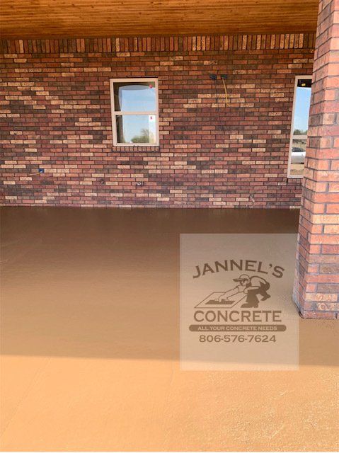 A brick wall with a window and a sign that says jannel 's concrete