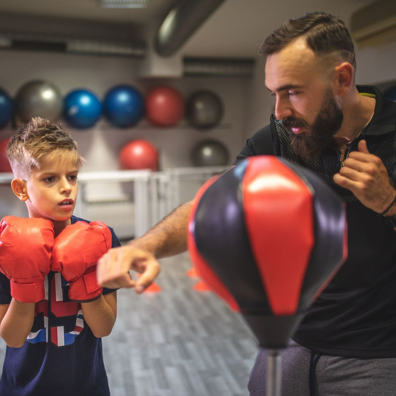 A child is doing private training with his personal trainer – Lake Dallas, TX - Legacy Boxing Gym