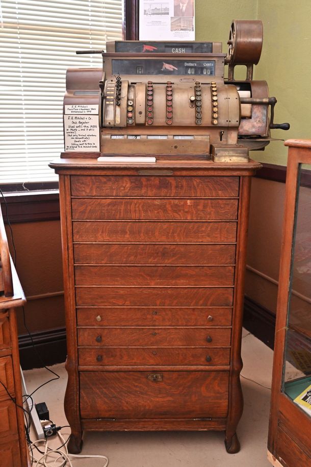 Vintage cash register on a cabinet in a store interior displayed at Conway County History Museum | morrilton arkansas