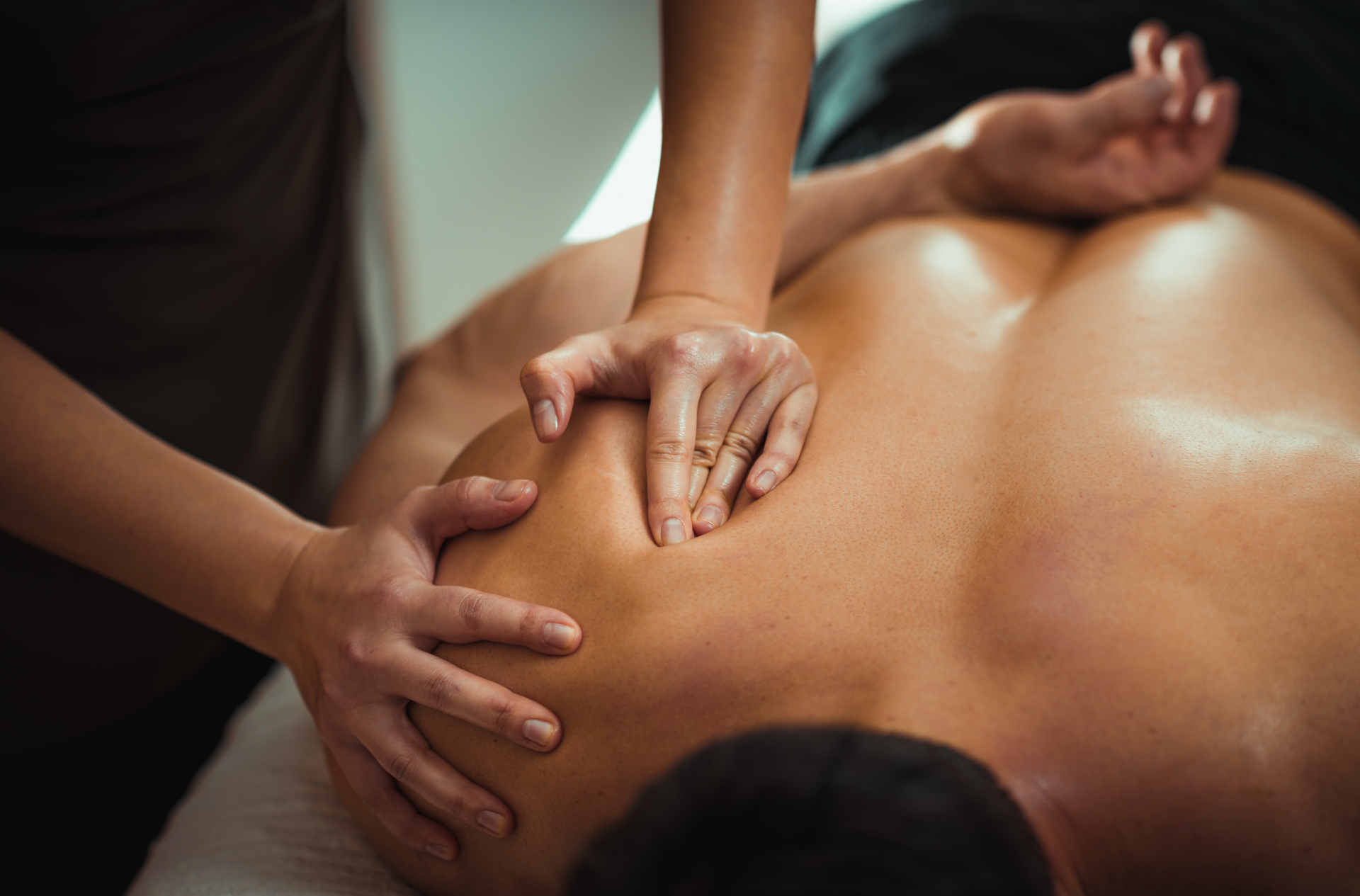 A man is getting a massage at a spa.